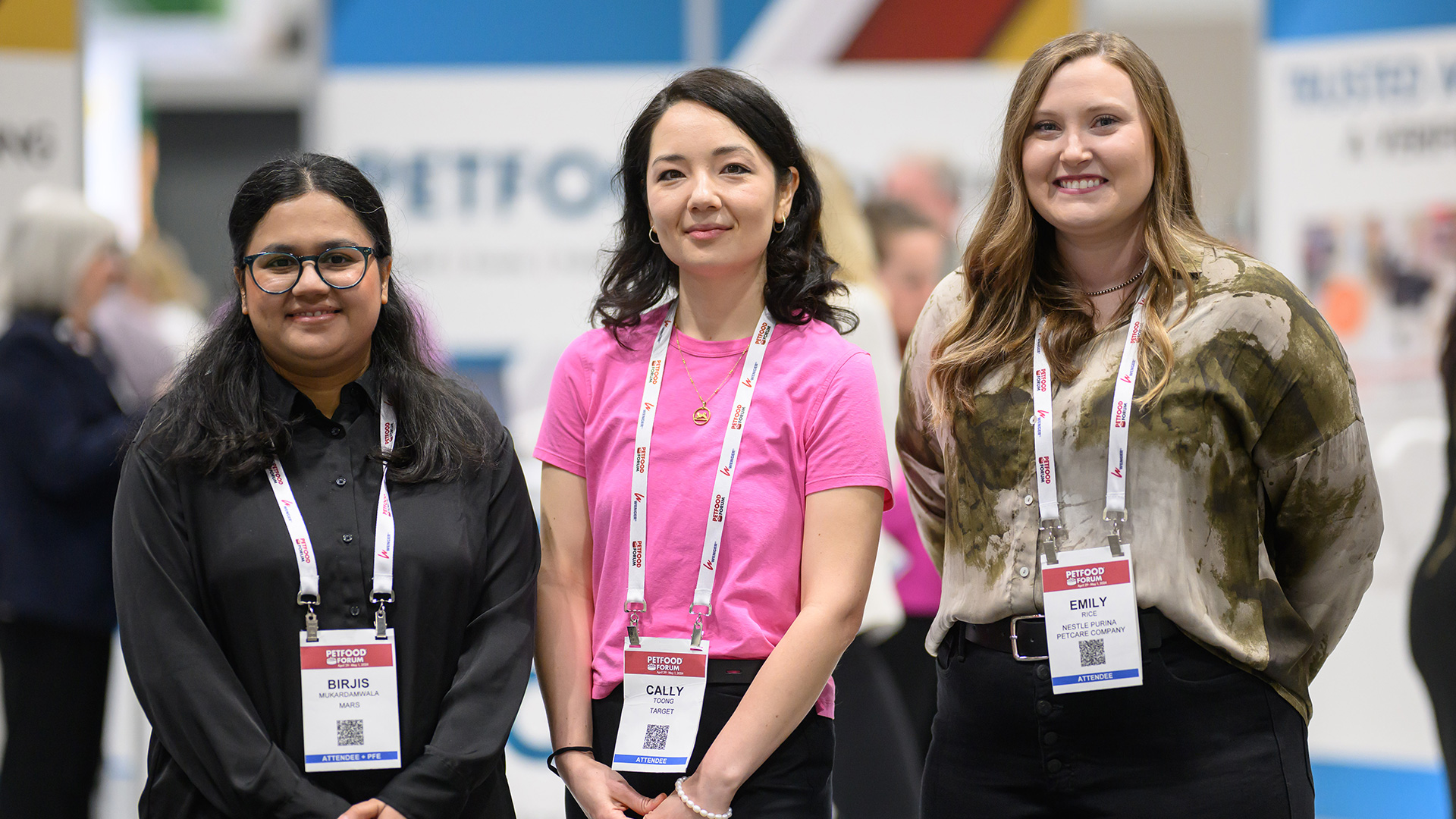 Three women pose for the camera at Petfood Forum