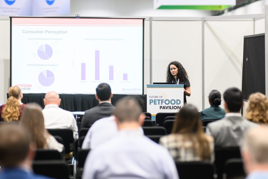 Female student presenting research at Petfood Forum